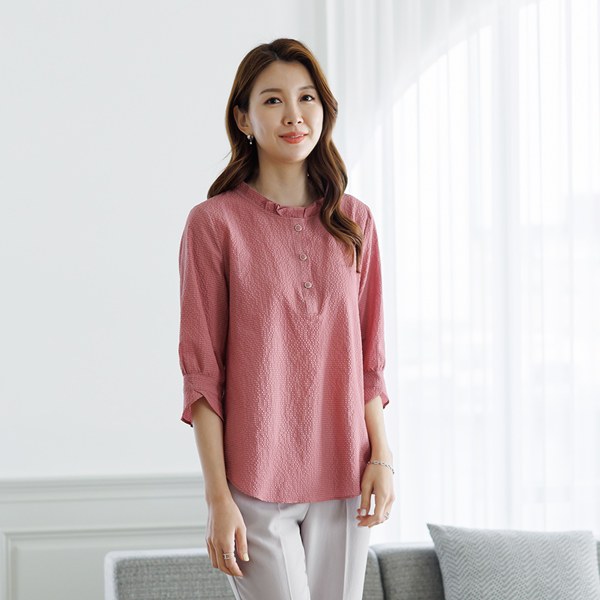 Korn frill neck blouse